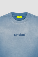 UNTIED® THE ENTRY COLLECTION SS26 ENSIGN BLUE SUN FADED T-SHIRT